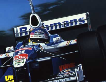 Jacques Villeneuve wins the 1997 World Drivers' Championship, driving the Constructors' Championship-winning Rothmans Williams Renault FW19 V10.